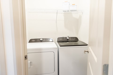 the crest at acworth laundry closet with washer and dryer appliances