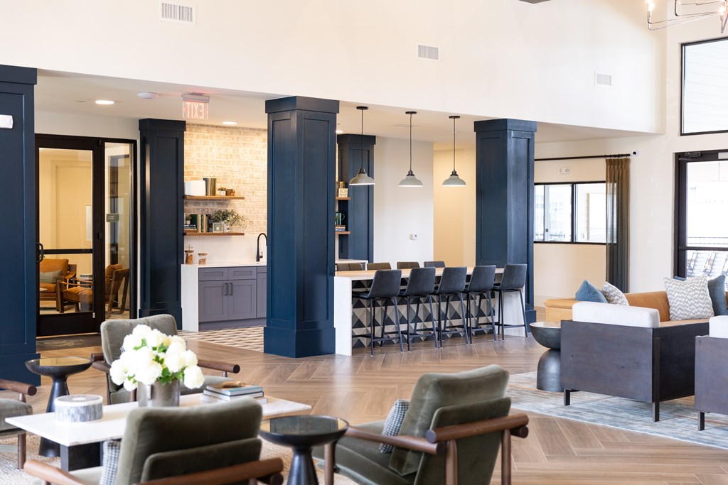 A large room with a long table and chairs. at The Crest at Oakwood Apartments, Oakwood , Georgia