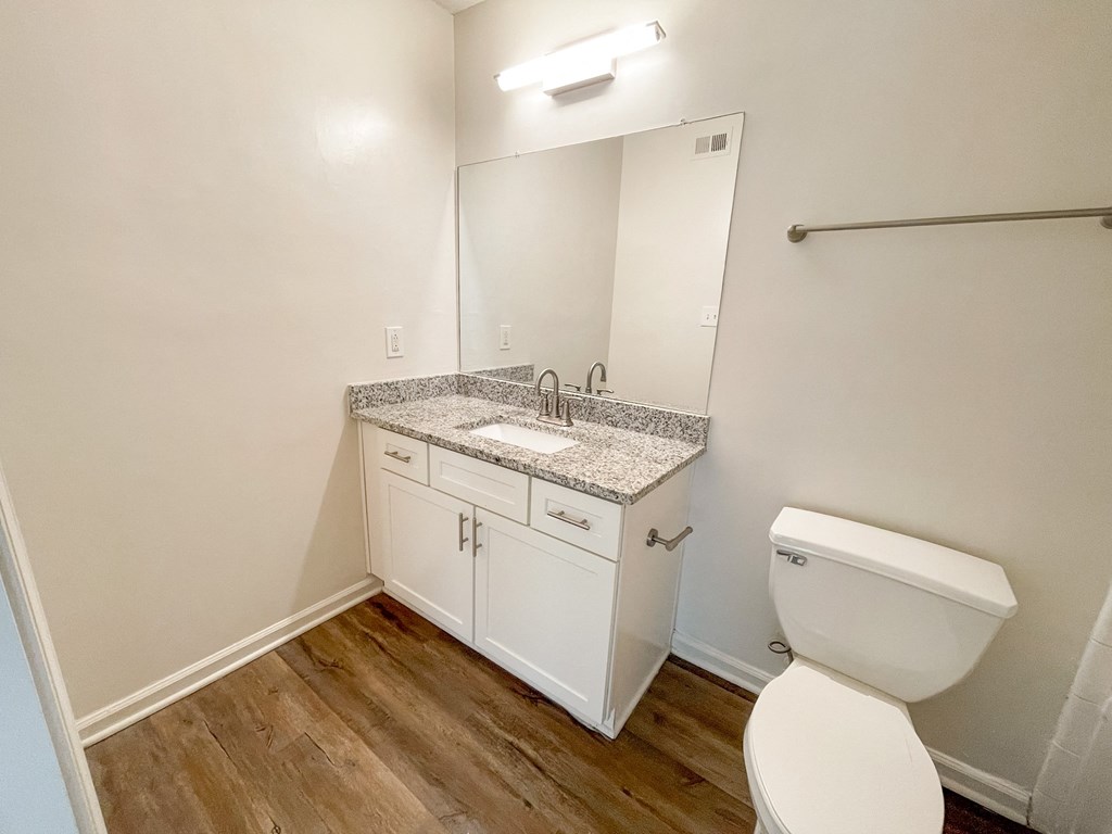 The Crest at Berkeley Lake St James renovated main bathroom with granite countertops located in Duluth, GA 30096