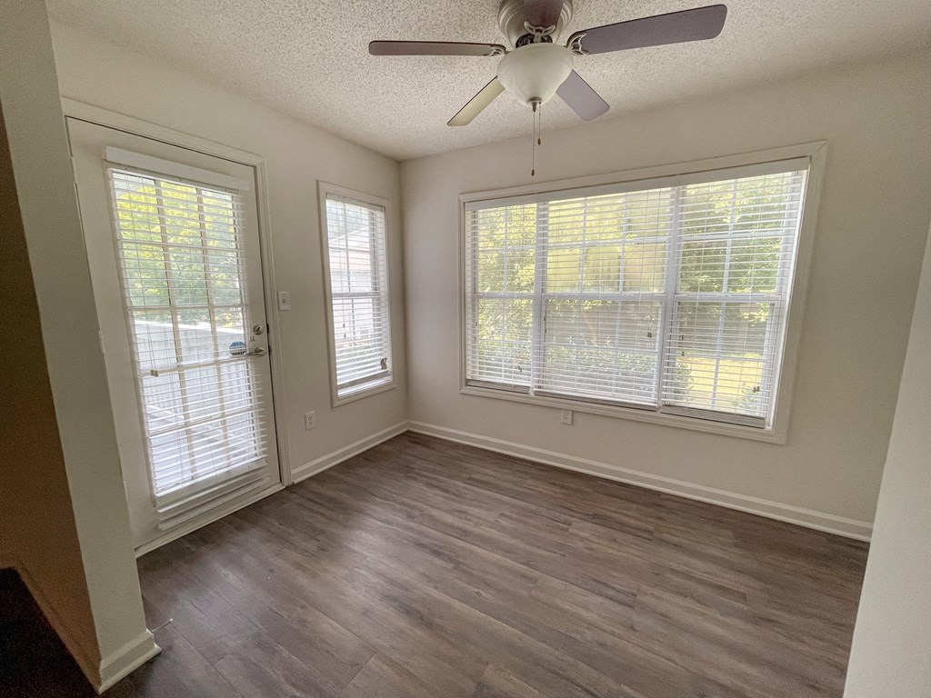 The Crest at Berkeley Lake St James renovated sunroon with wood style plank flooring located in Duluth, GA 30096