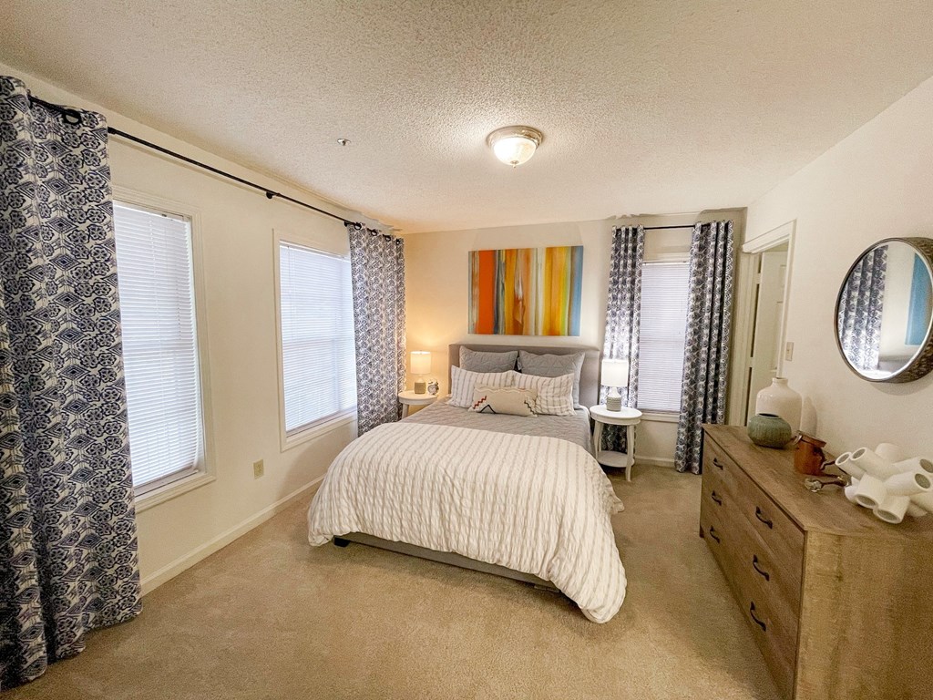 The Crest at Berkeley Lake model apartment bedroom with walk-in closet located in Duluth,GA