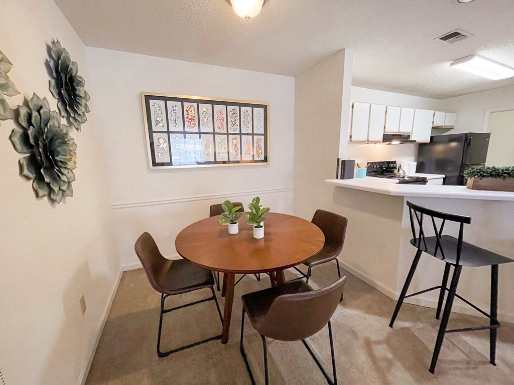 The Crest at Berkeley Lake model apartment dining space located in Duluth, GA 30096