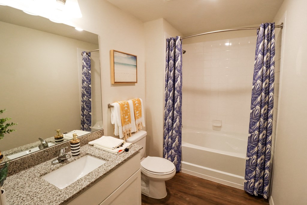 Apartment home primary bathroom with garden style soaking tub  at The Crest at Naples, Naples, FL