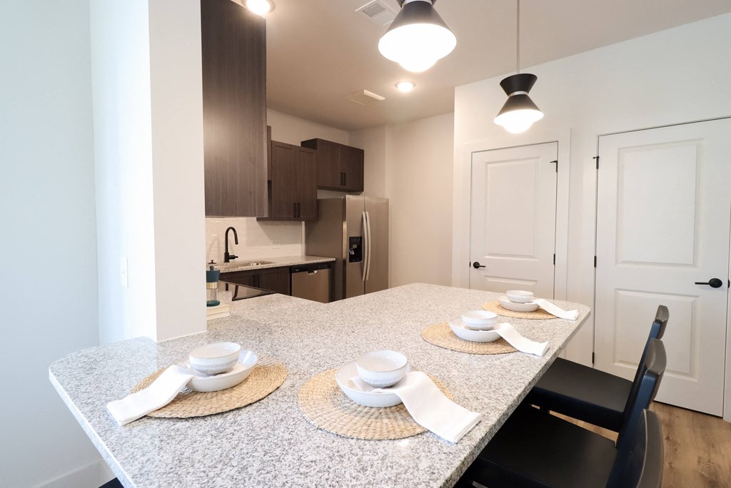 Kitchen with Barstool Seating at The Crest at South Point Apartments, Davenport , Georgia