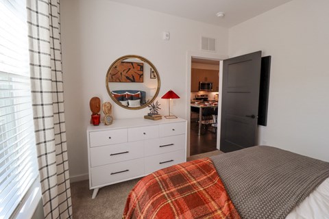 The Wren 1 bedroom model apartment home bedroom with oversized window located in Lawrenceville,GA