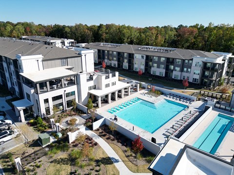Aerial view of resort style pool and amenity center at The Wren Apartments, Georgia