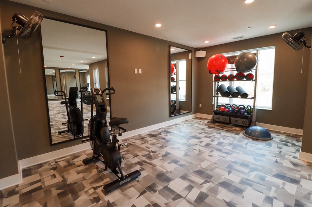 The Wren Fitness Studio yoga room exercise bike and equipment