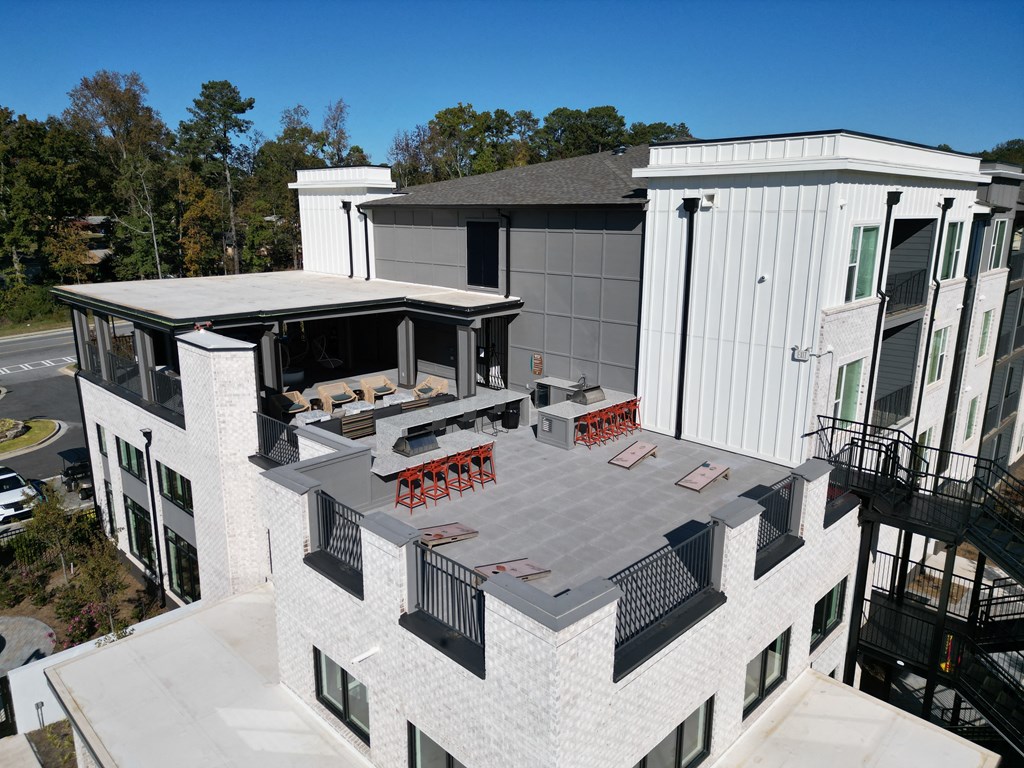 an aerial view of a roof terrace at a building with a patio at The Wren Apartments, Lawrenceville, GA, 30043