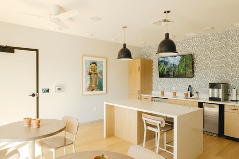 a kitchen and dining area with a table and chairs
