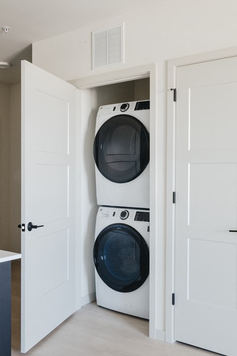 a small laundry room with a washing machine and a dryer