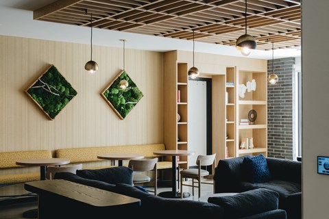 a living room with couches tables and chairs and