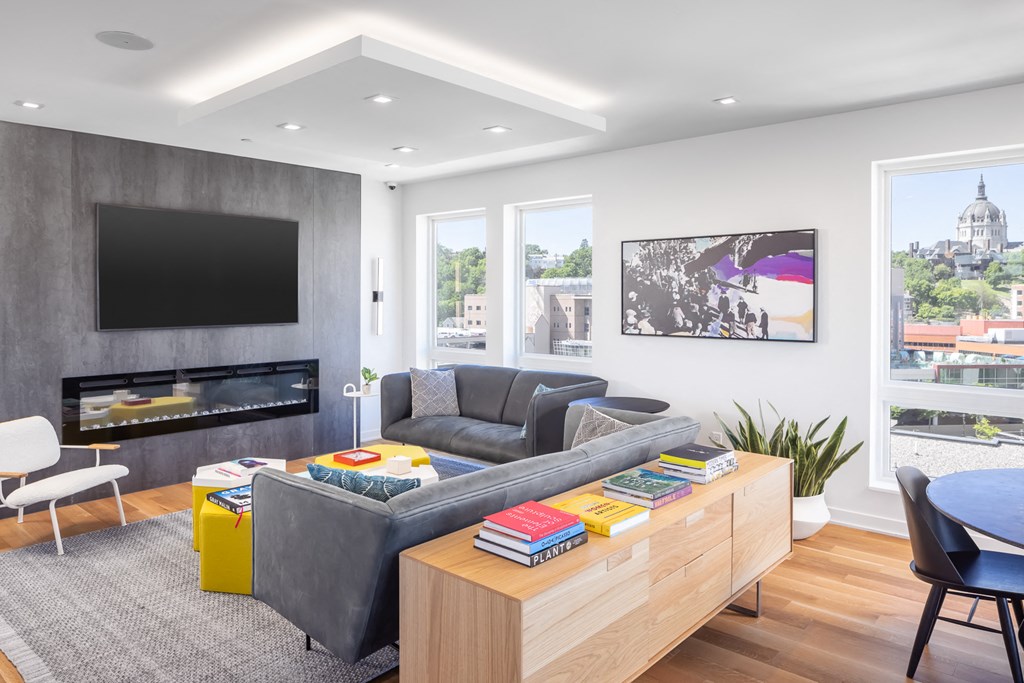 a living room with a couch and a table and a television