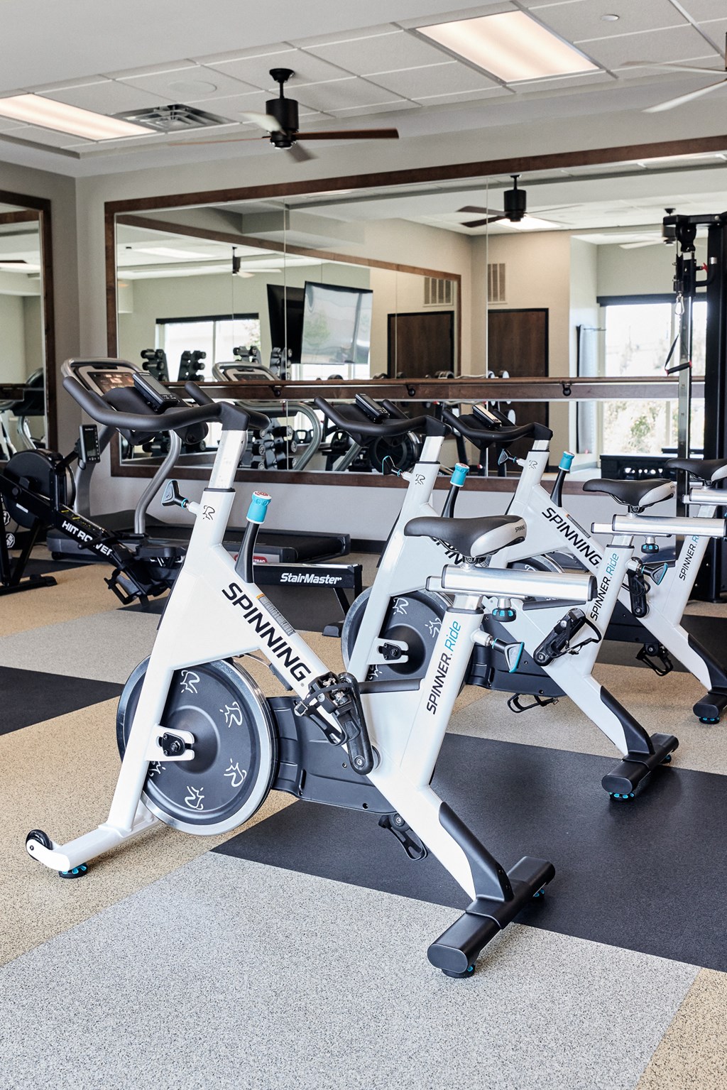 a spin bike in a gym with other exercise equipment