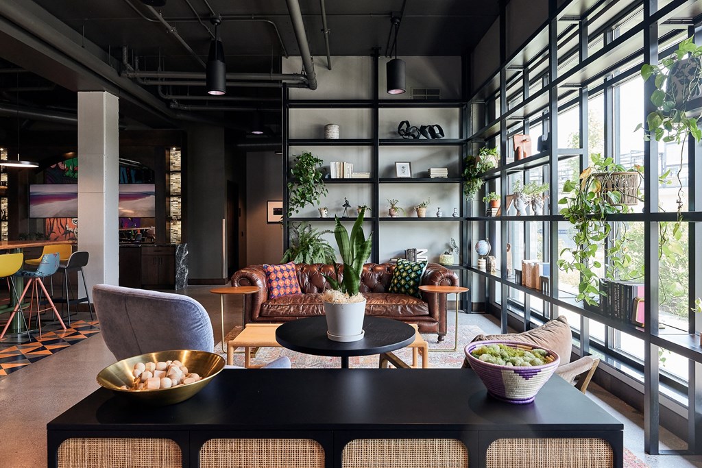 a living room with couches and a table with bowls of food