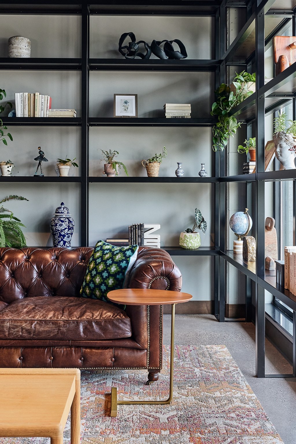 a living room with a leather couch and a coffee table
