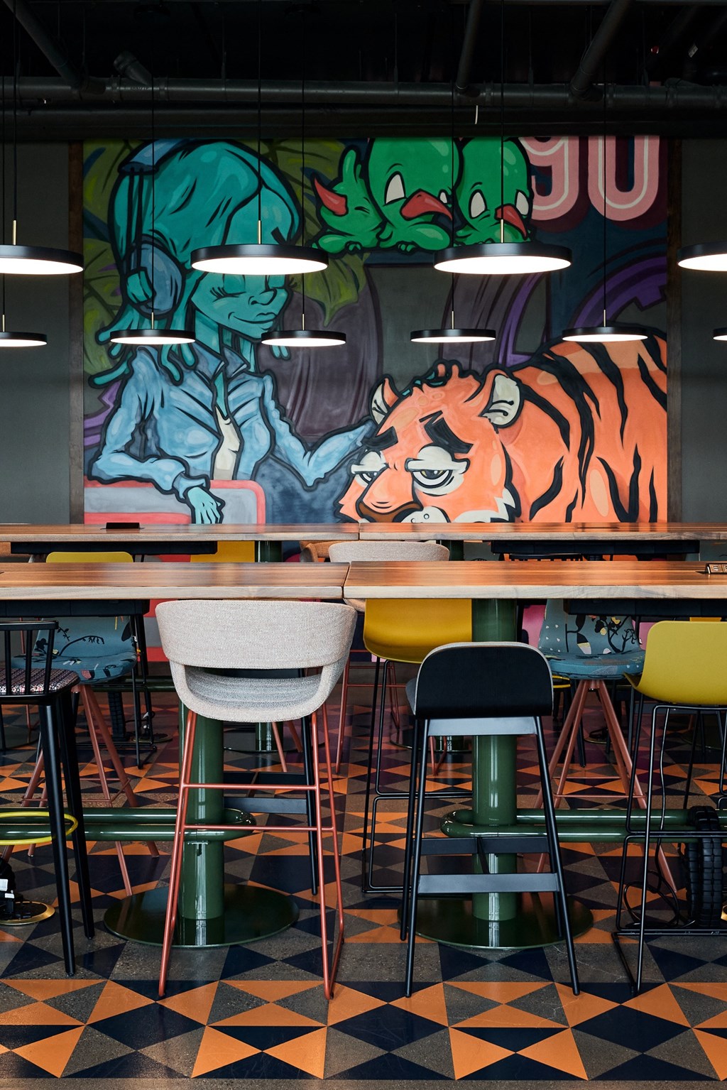 a bar with a mural of a tiger on the wall