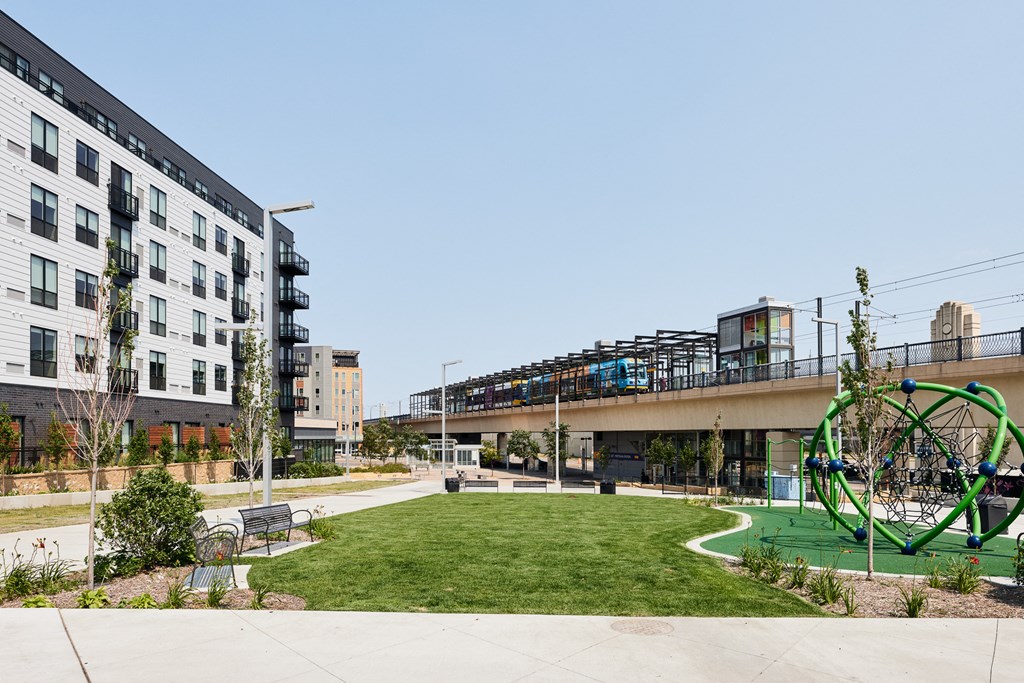 a park with a playground and a bridge