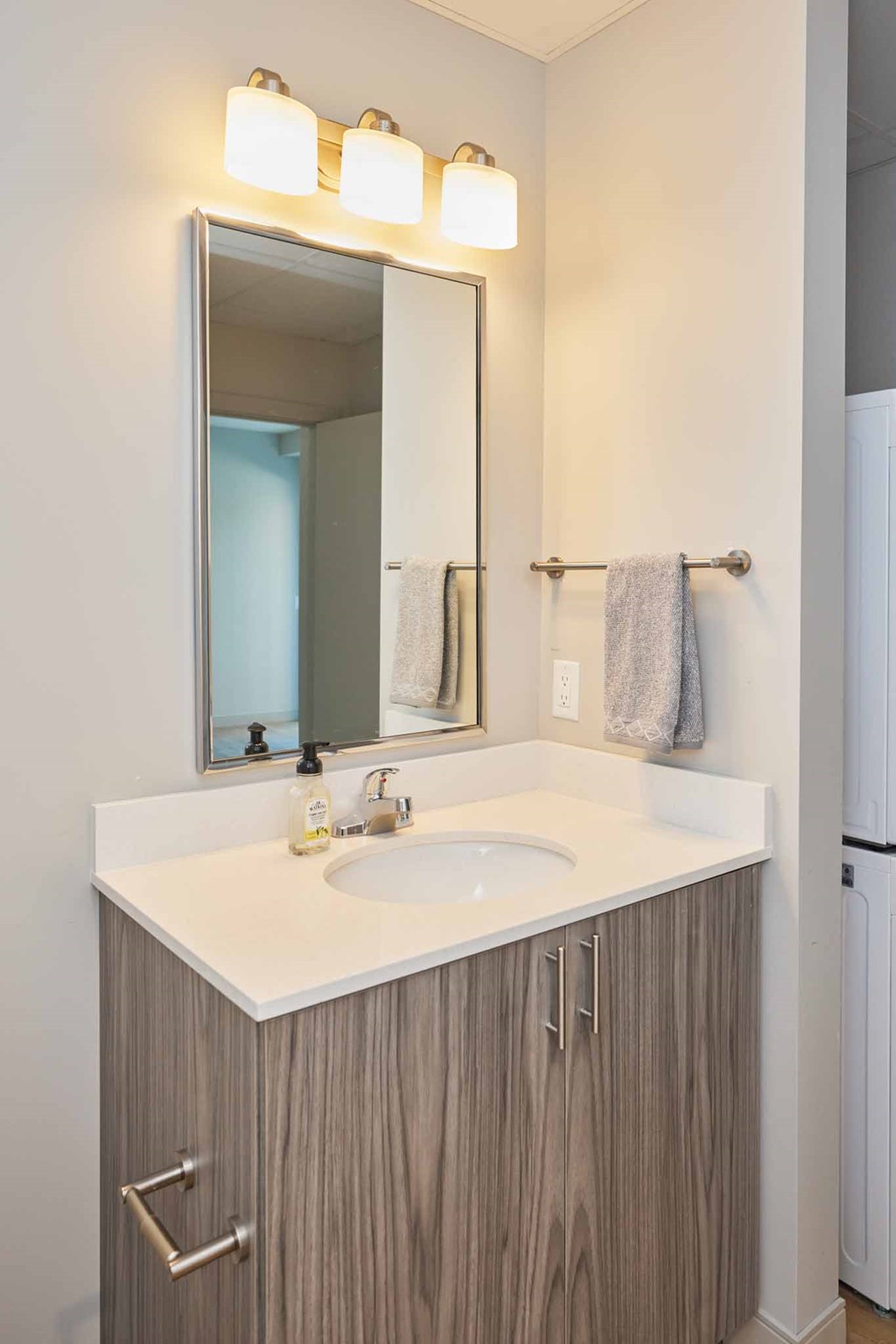 a bathroom with a sink and a mirror