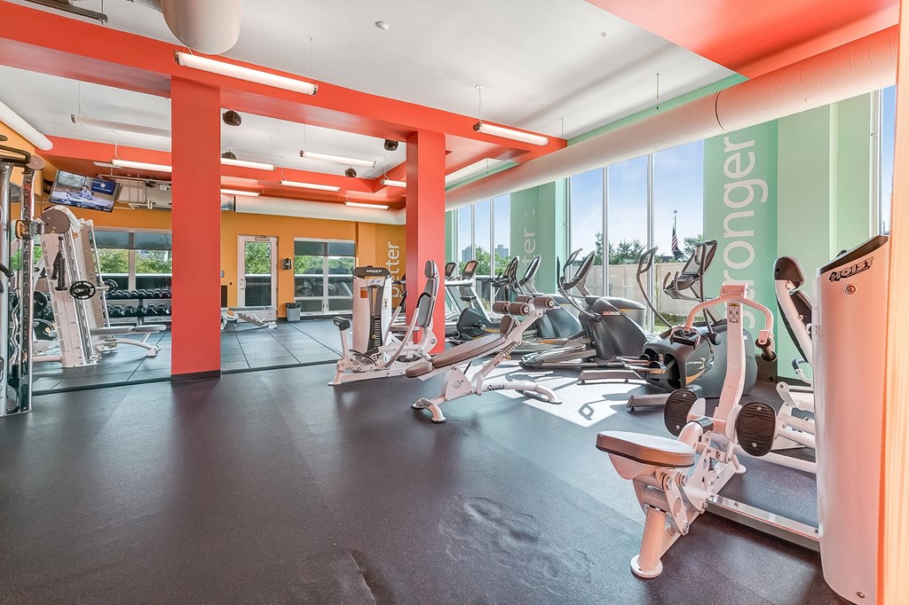 a gym with treadmills and other exercise equipment at aria resort and spa