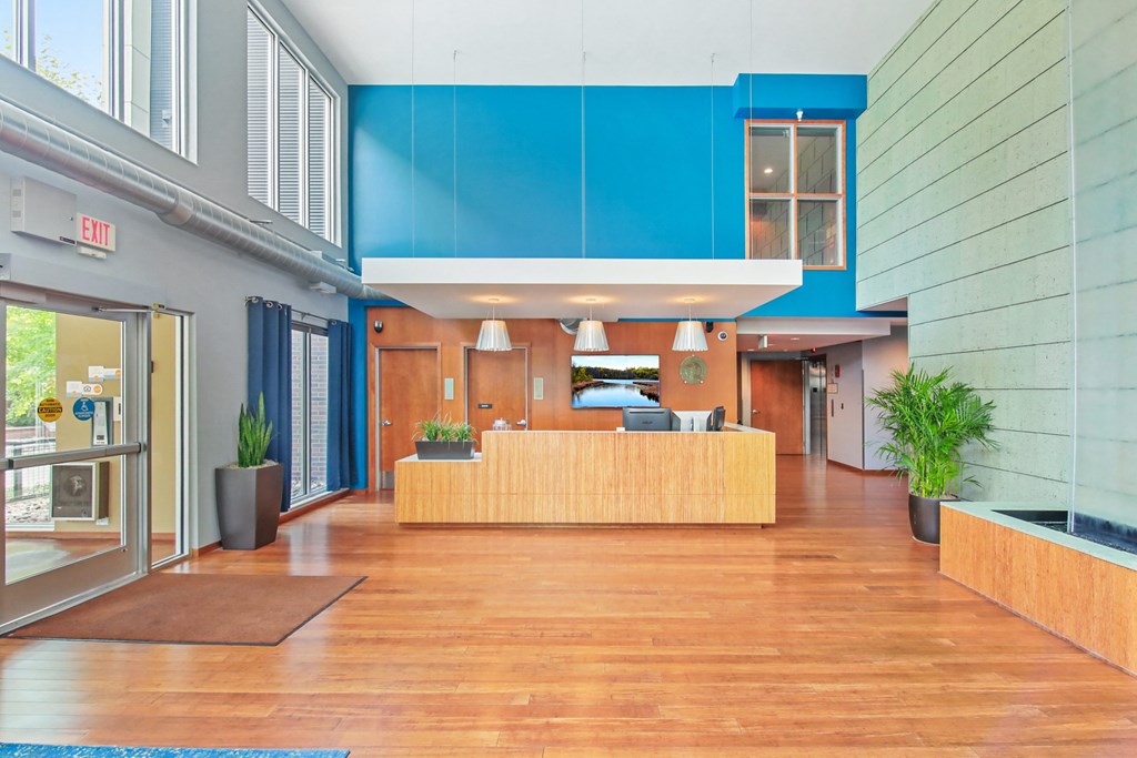 the lobby or reception area of a hotel with a reception desk