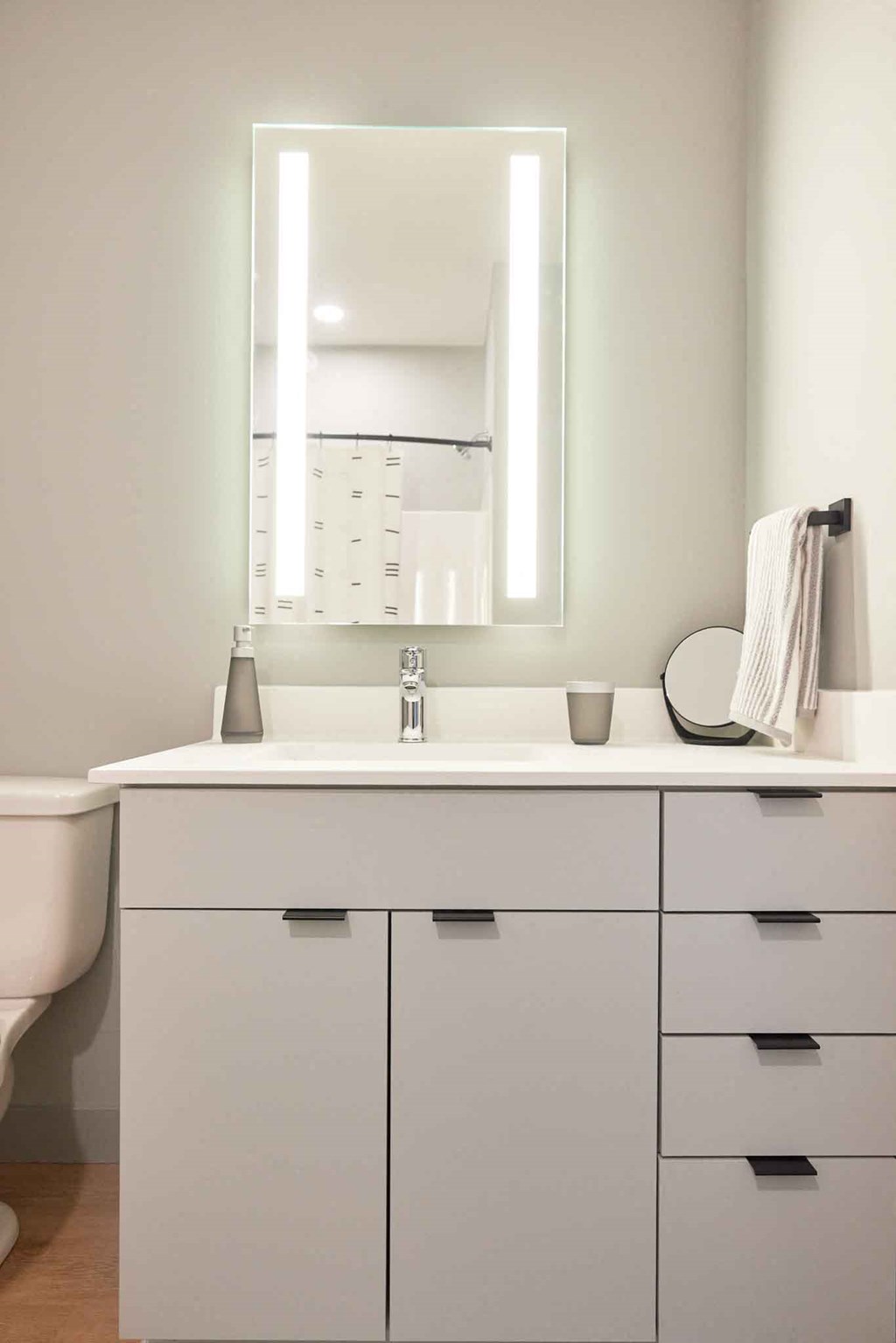 a bathroom with a sink and a mirror