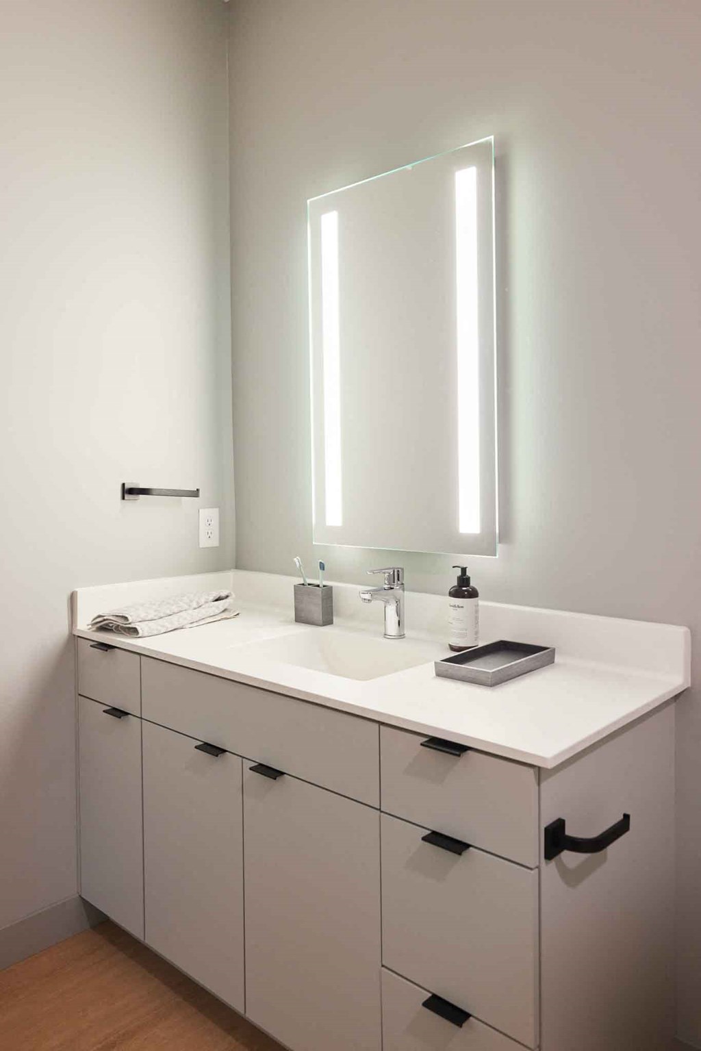 a bathroom with a sink and a mirror