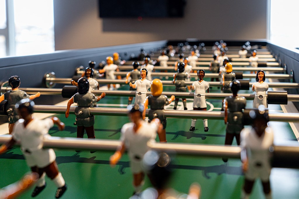 a group of toy football players in a stadium