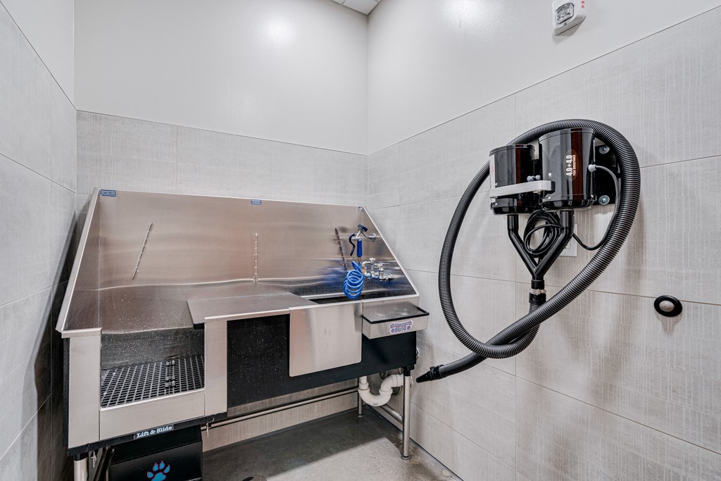 a kitchen with a stove and a sink and a gas