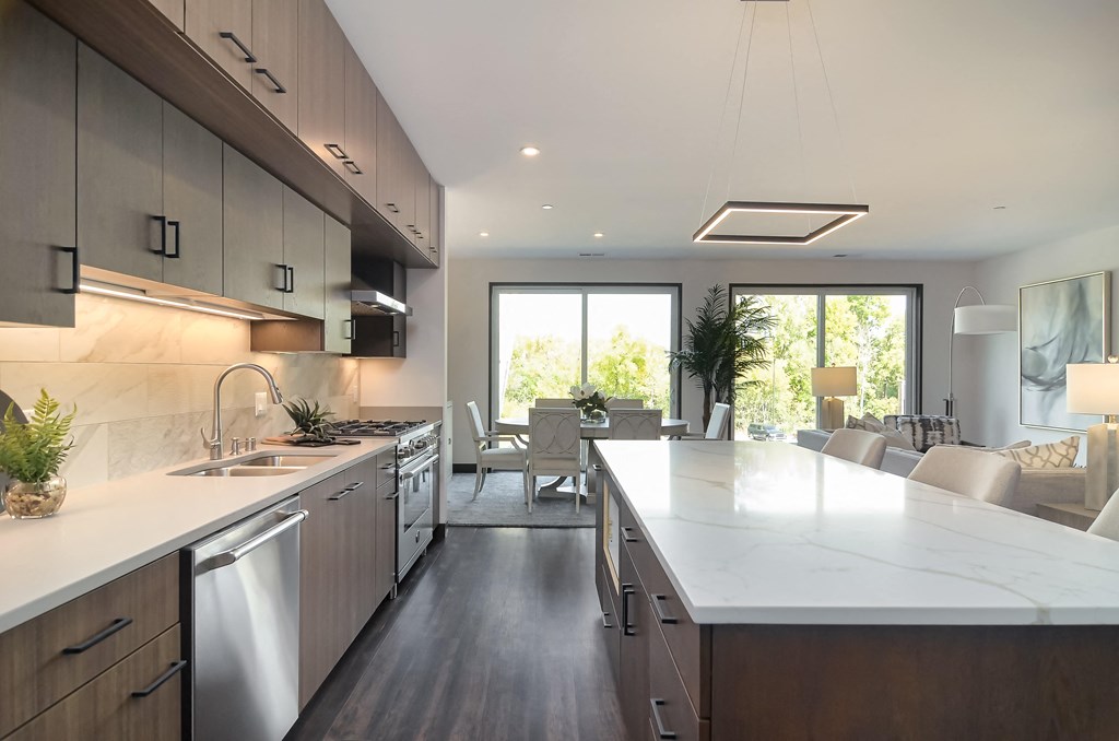 a modern kitchen with a large island in the middle
