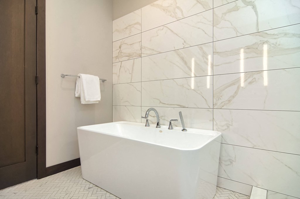 a white bathroom with a sink and a mirror