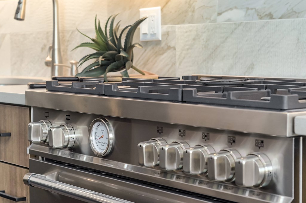 a close up of a stove top oven in a kitchen
