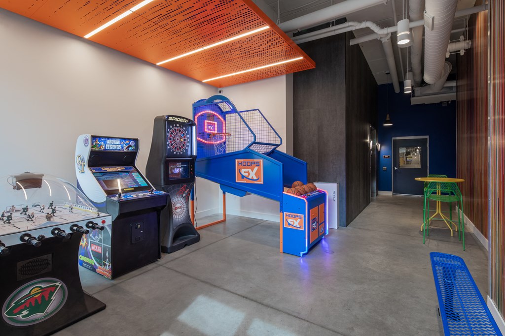 a room with arcade games and other gaming equipment