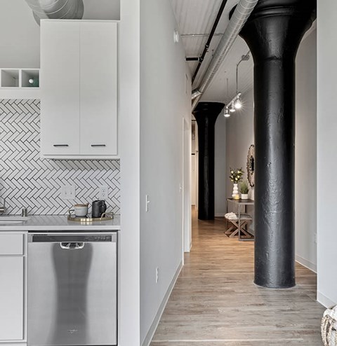 A kitchen with a dishwasher and a sink.