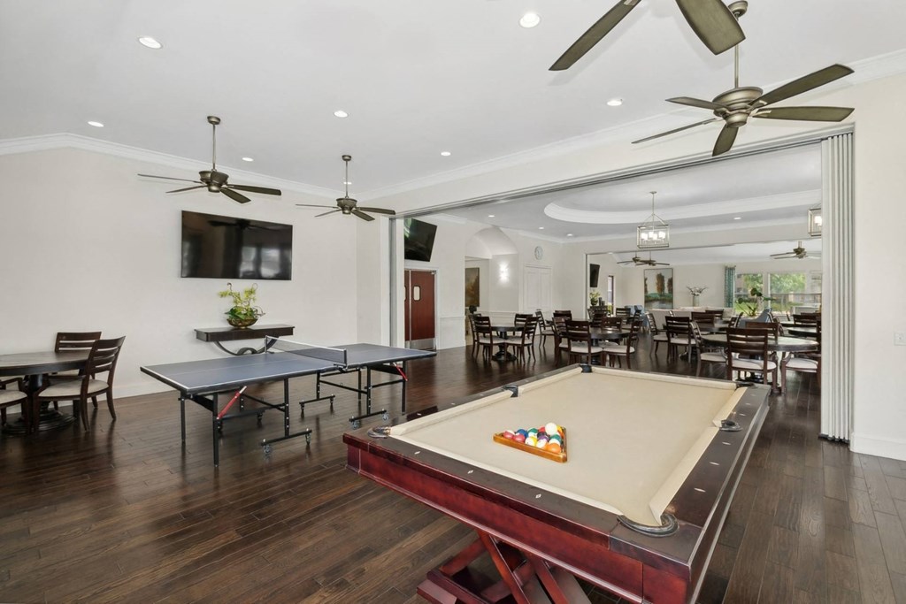 social lounge and game room area with billiards and ping pong at Retreat at Wylie senior 55+ apartments