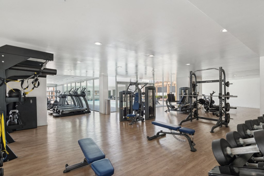 high-impact fitness center with free weights at One Santa Fe apartments