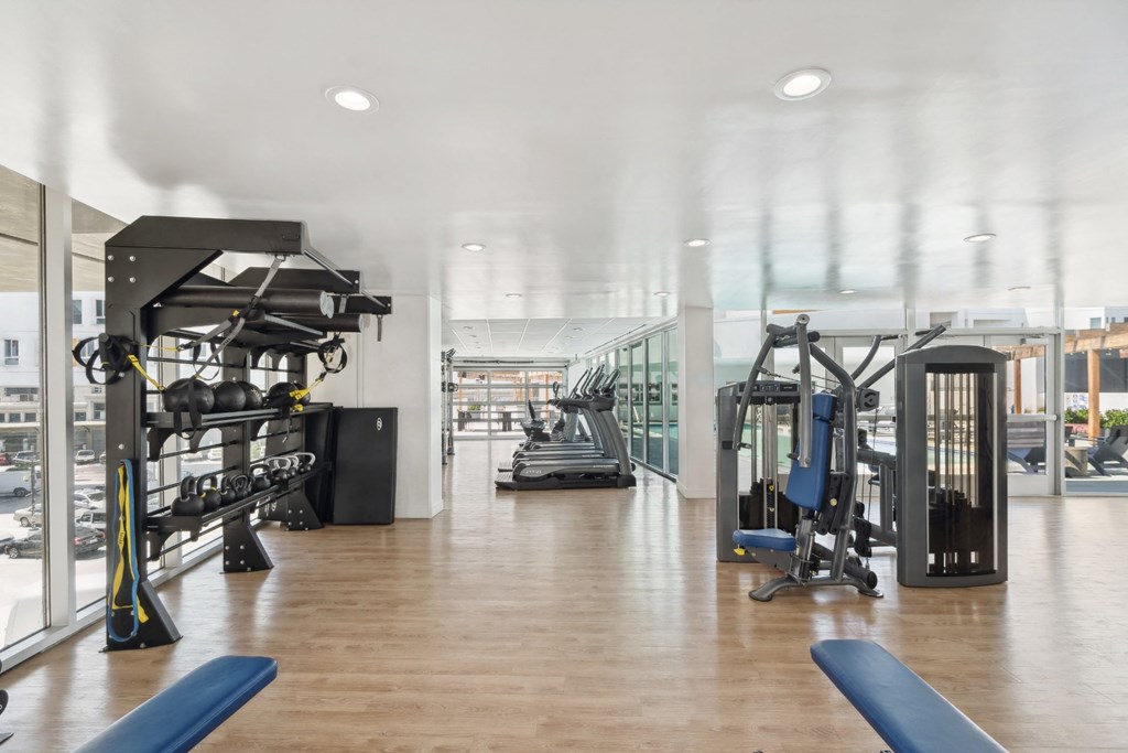 fitness center with strength training and cardio equipment at One Santa Fe apartments