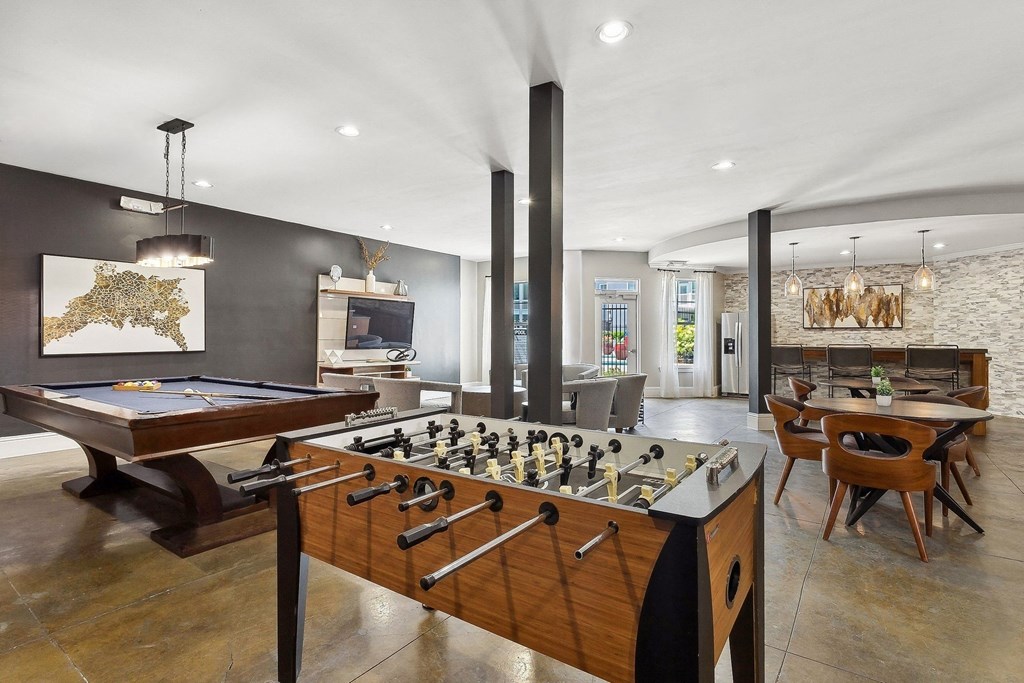 game room with a foosball table and billiards at Sorelle apartments