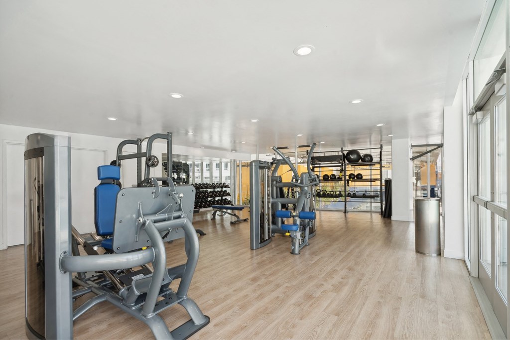 fitness center with free weights at One Santa Fe apartments