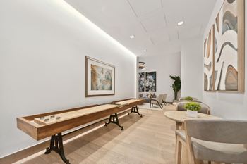 social lounge area with shuffleboard at Via Seaport apartments