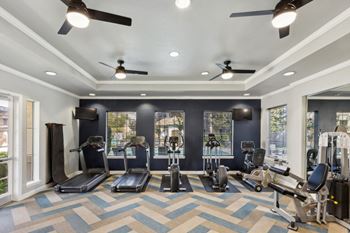 fitness center with cardio equipment at Bridgeport Ranch apartments