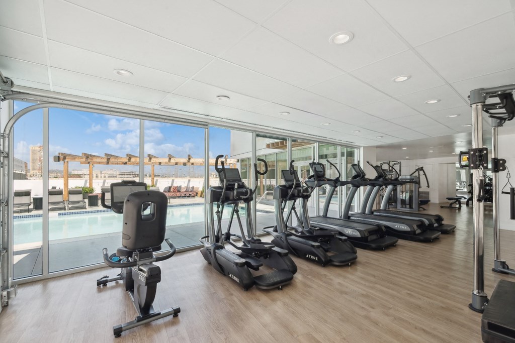 fitness center with cardio machines at One Santa Fe apartments