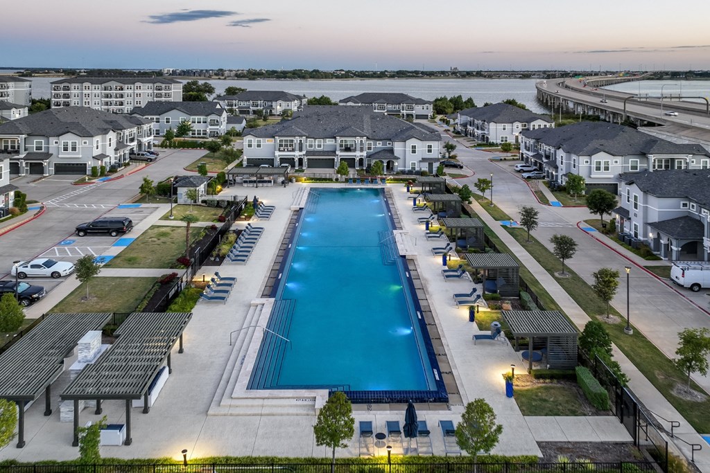 resort-inspired swimming pool at Reveal on the Lake apartments