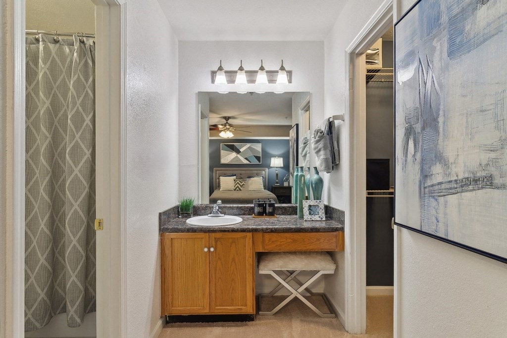 bathroom with designer lighting at The Berkshires at Vinings apartments