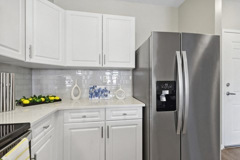 kitchen with stainless steel appliances at HighPoint luxury apartments in Quincy, MA