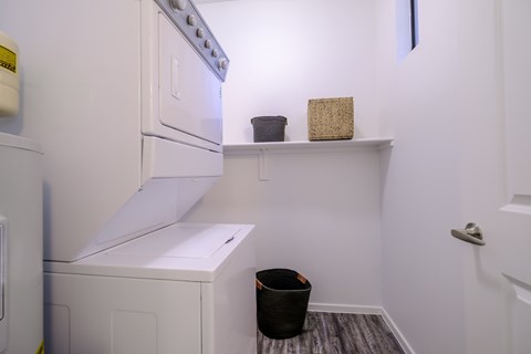 A white oven and dishwasher in a small kitchen.