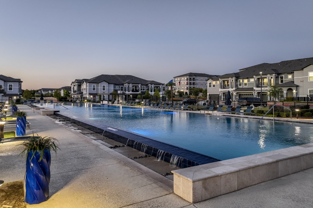 resort-inspired swimming pool at Reveal on the Lake apartments