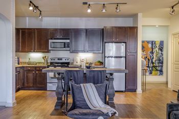 spacious kitchen with stainless steel appliances at The Pradera apartments