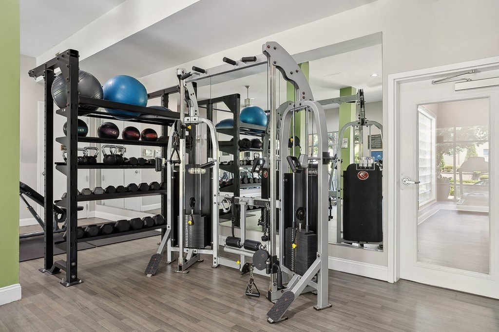 fitness center with free weights and strength training equipment at Sorelle apartments