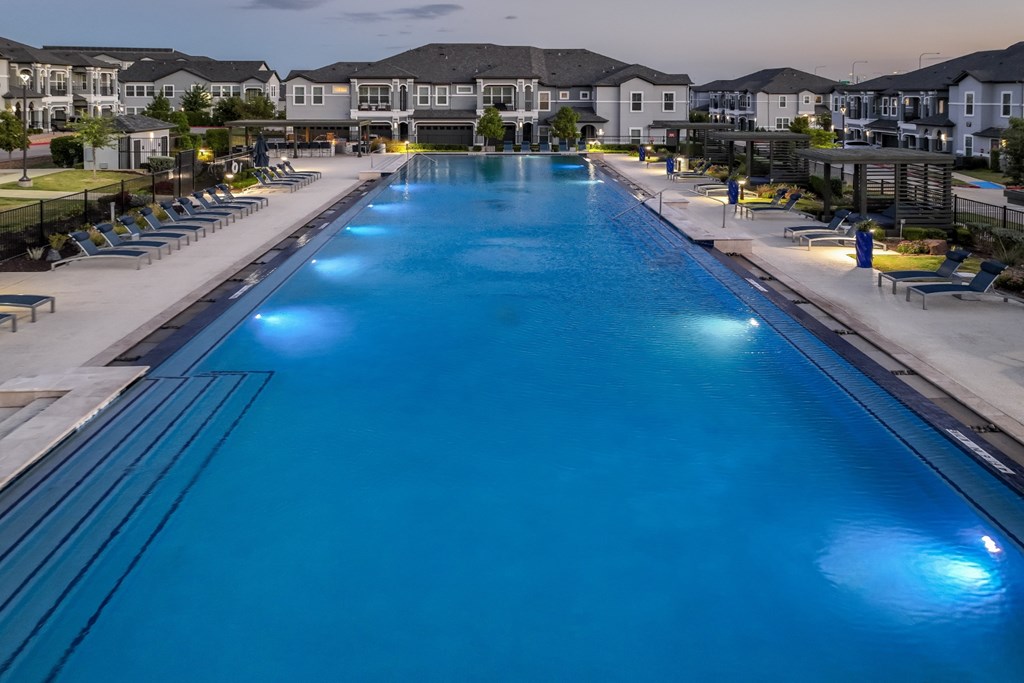 resort-inspired swimming pool at Reveal on the Lake apartments