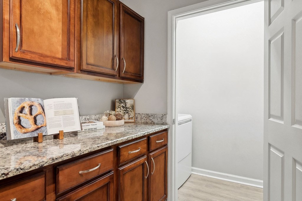 kitchen and laundry closet at Sorelle apartments